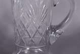 Diversas peças de cristal lapidado, sendo jarra... - Diversas peças de cristal lapidado, sendo jarra para água, 11 copos curtos diversos modelos e 3 copos longos. Total: 15 peças.