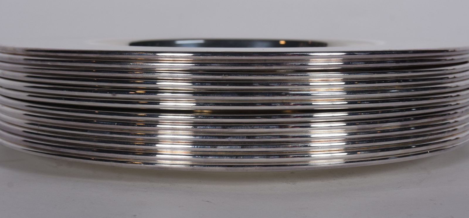 Conjunto com 12 souplats de metal prateado Wolff. Com arranhados. - foto 4 de 5