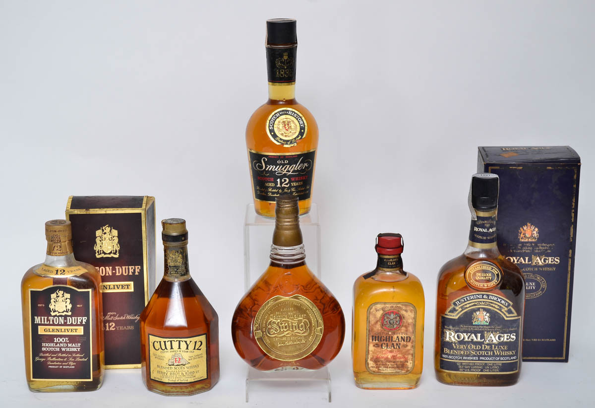 Seis garrafas de whisky diversos.