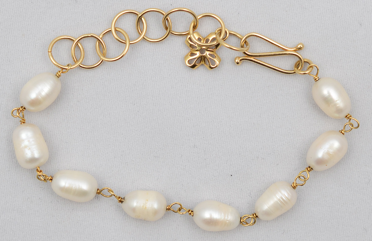 Pulseira de ouro 18 k e madrepérolas. Peso total 11 g - Comprimento...