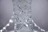 Diversas peças de cristal, sendo: cesta lapidad... - Diversas peças de cristal, sendo: cesta lapidada, vaso  com "grega" fosca na base e na borda; e, 11 copos para vodka (modelos diferentes).