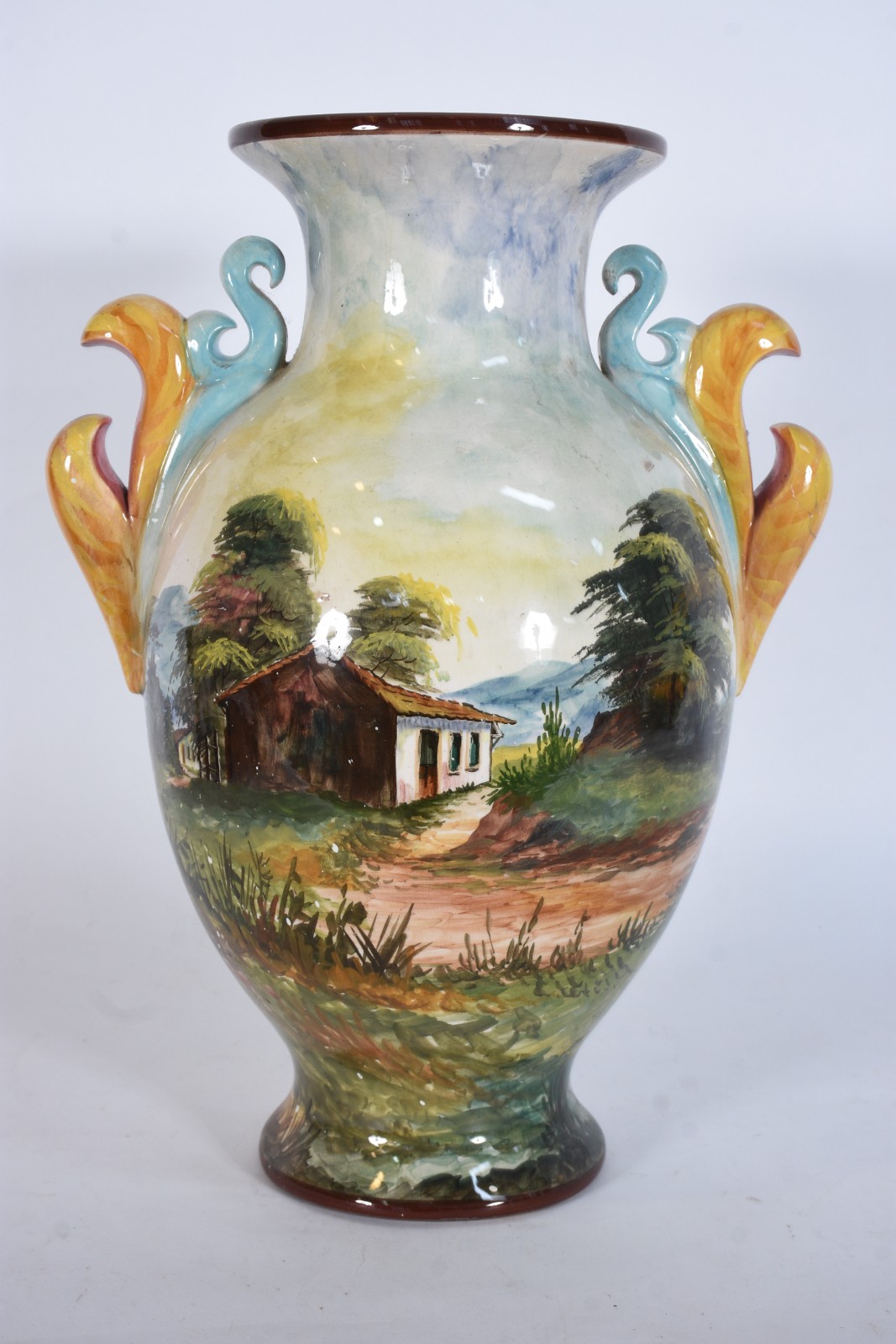 Vaso de faiança com paisagens em policromia, pegas laterais... - foto 1 de 6