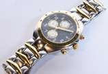 Bulova (1875),  - Relógio de pulso Marina Star 100m, calendário, apresenta pulseira de aço com detalhes dourados, fundo azul. Acompanha caixa  (Por motivos de segurança