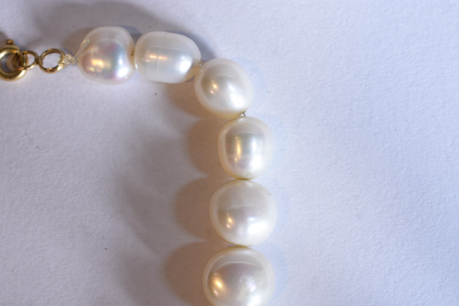 Pulseira com fecho e argolas em ouro 18 k feitio com 19 perolas... - foto 4 de 5