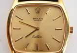 Rolex (1905),  - Relógio Rolex de pulso modelo "Cellini", caixa de ouro 18 k, fundo dourado, a corda, pulseira de couro (pulseira não é original). Marcas de uso. Funci