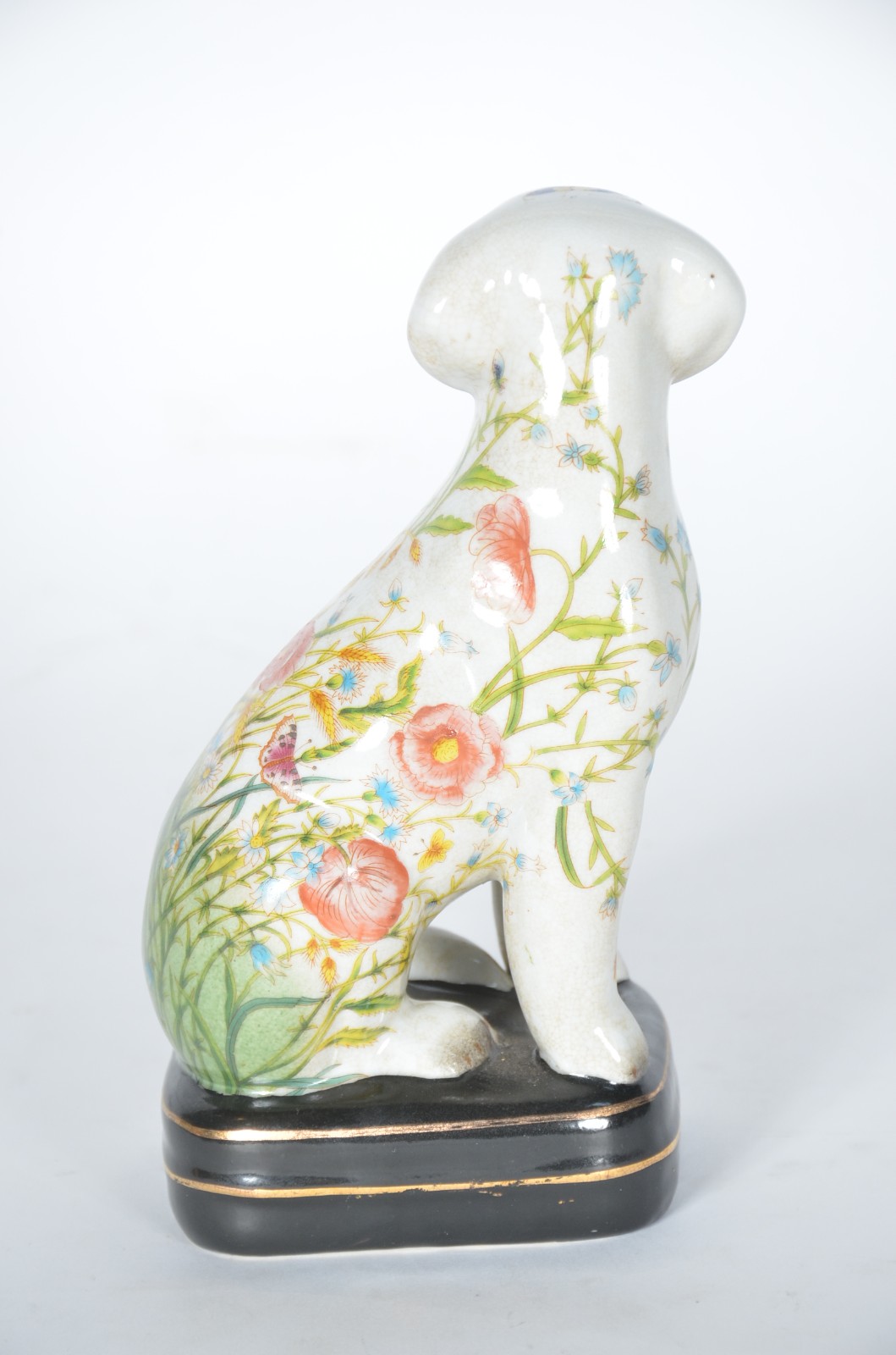 Estatueta de cerâmica representando cachorro com folhagens e flores... - foto 4 de 7