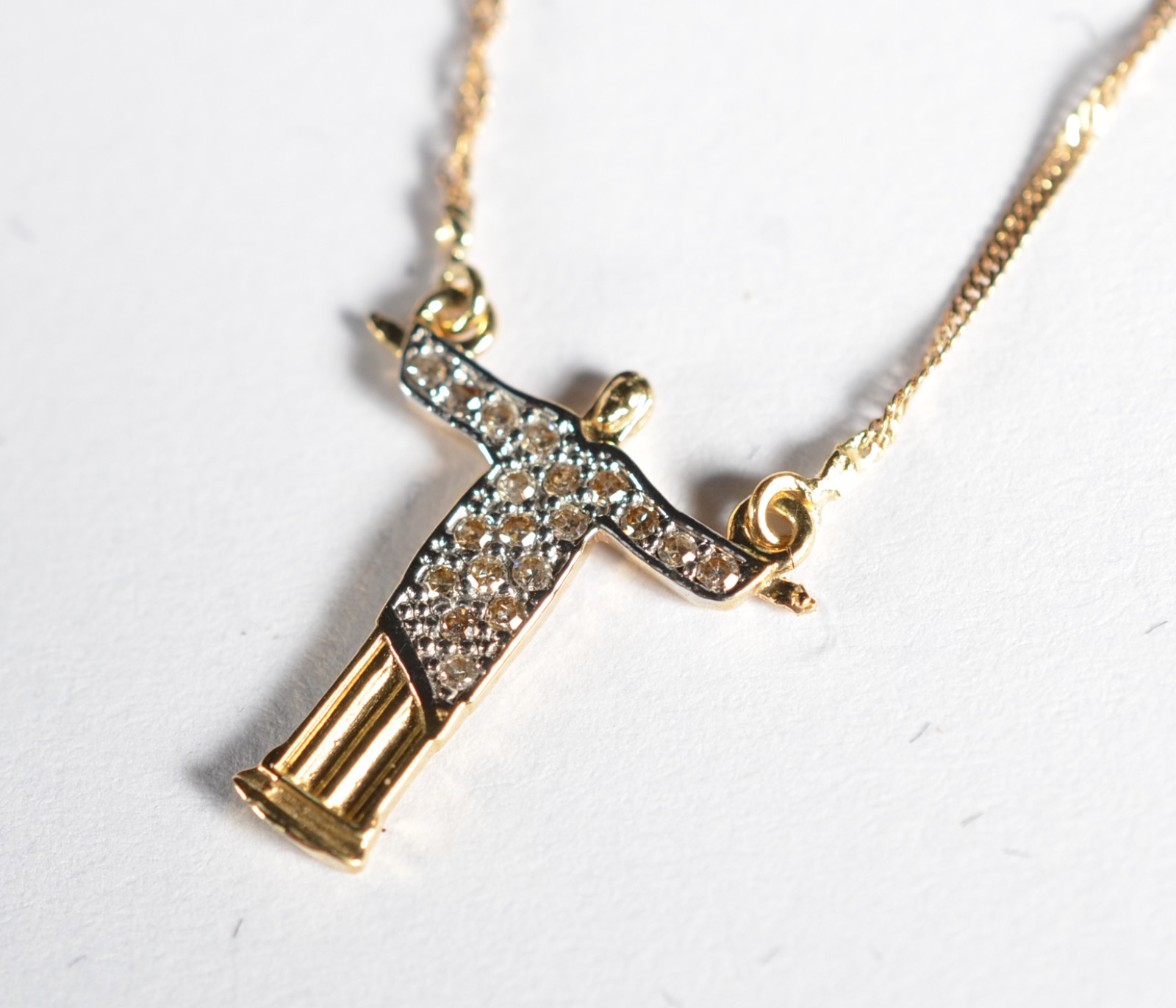 Cordão com pingente de ouro 18k., contraste 750 feitio torcido com... - foto 3 de 5