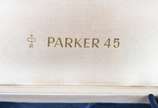 PARKER,  - Conjunto de canetas Parker 45, tinteiro e esferográfica, douradas, no estojo.