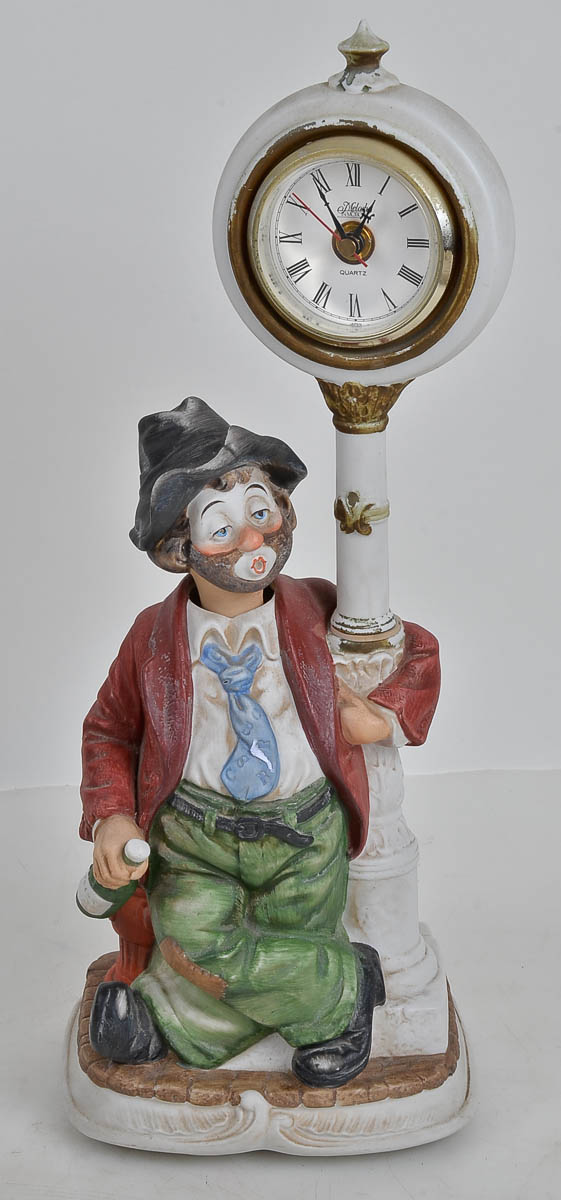 Relogio de porcelana repres.bêbado assoviador. Alt. 40cm.
