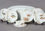Serviço para peixe de porcelana Rosenthal compo... - Serviço para peixe de porcelana Rosenthal composto de: 6 pratos, molheira e travessa. Total: 8 peças.