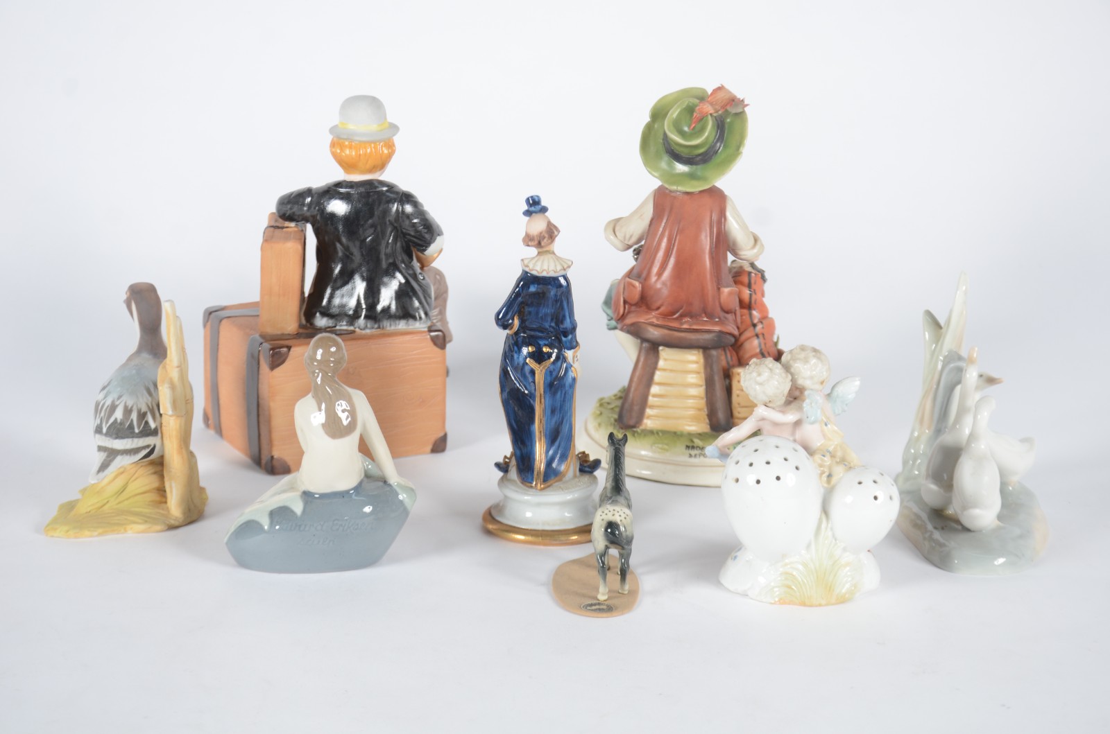 Sete esculturas diversas de porcelana, sendo: Figura de bêbado... - foto 3 de 11