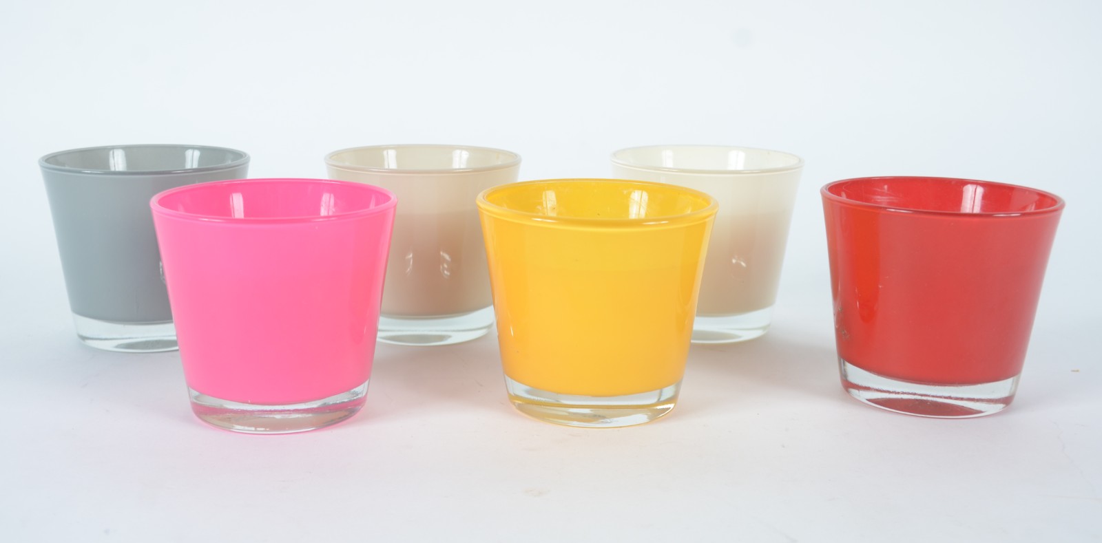 Seis porta velas de vidro em diversas cores. - foto 1 de 3