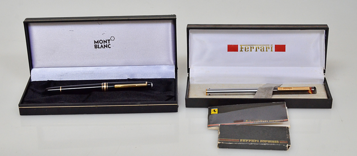 Duas canetas, sendo uma da marca MONTBLANC e outra FERRARI.