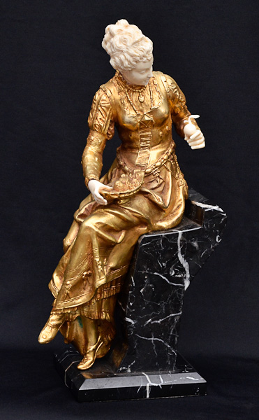 Estatueta de bronze e marfim criselefantina repres. dama com cesto de...