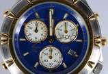 Bulova (1875),  - Relógio masculino com cronógrafo, modelo marina Star, calendário, pulseira e caixa em aço com detalhes dourados, fundo azul. (Por motivos de segurança