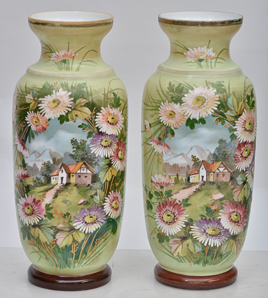 Par de vasos de opalina francesa com casas e flores em policromia, um...