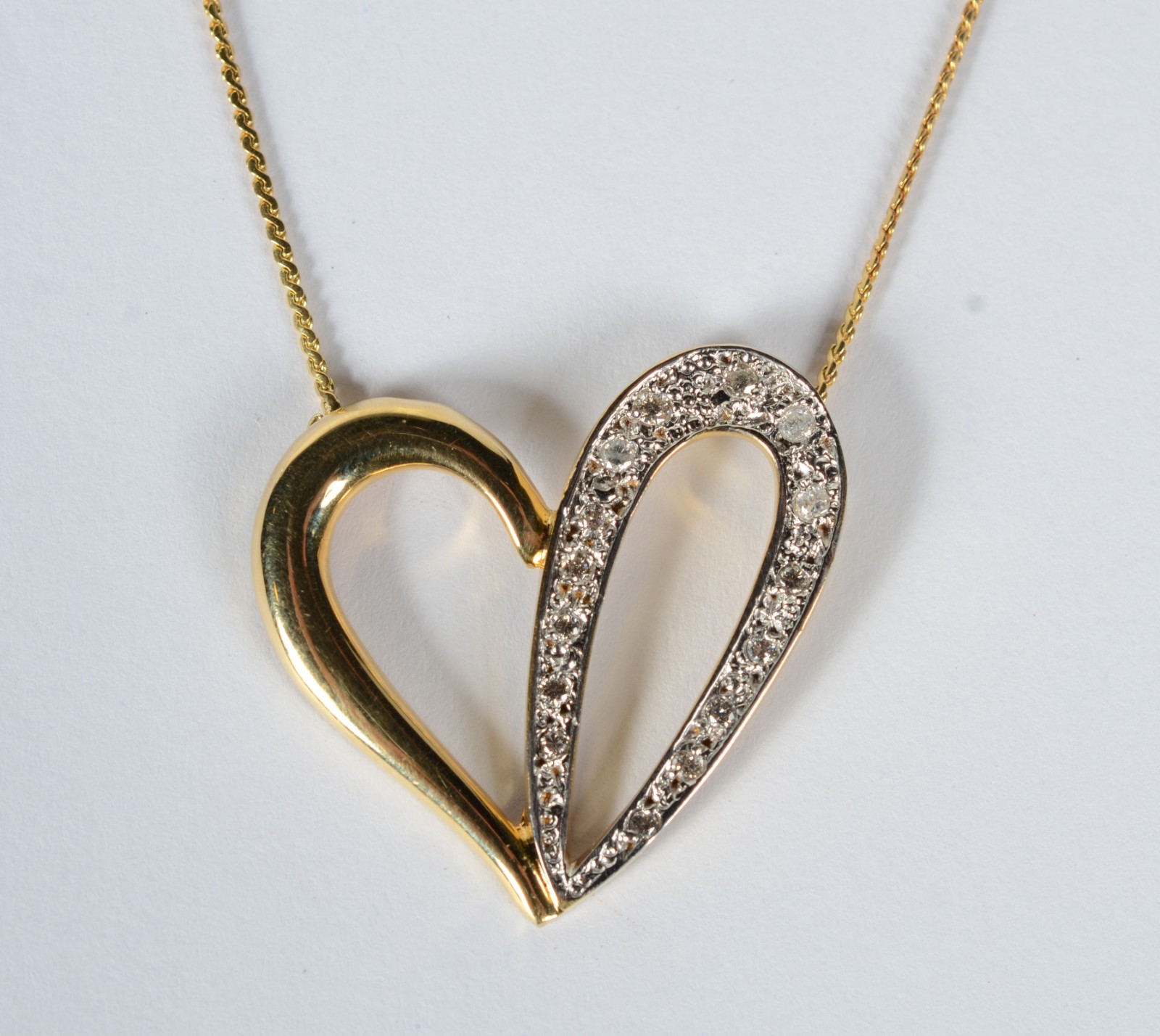 Colar com pendente de ouro 18 k, contraste 750 feitio coração vazado... - foto 1 de 8