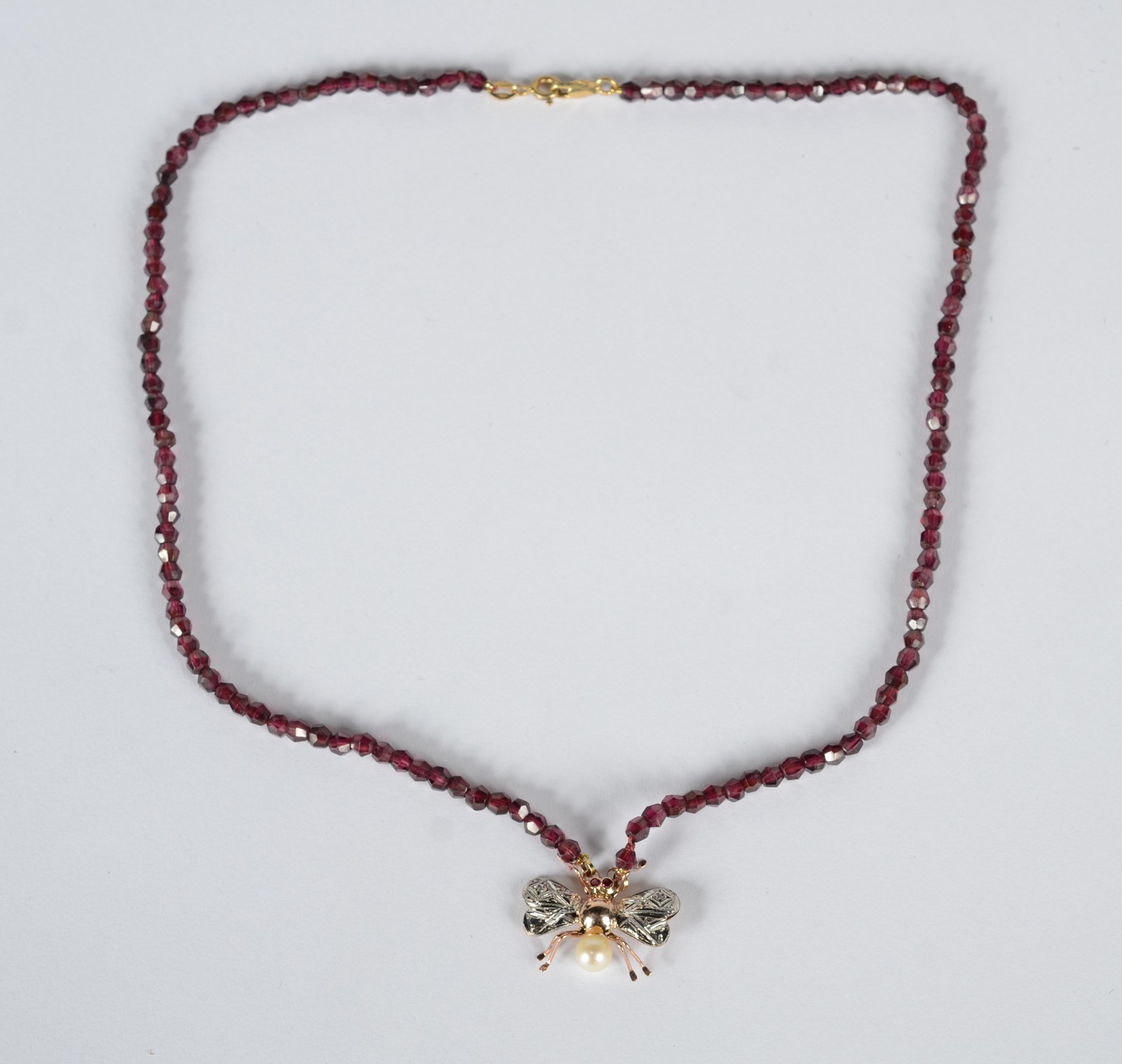 Pendente com fecho de ouro 18 k., fio granada com 272 pedras... - foto 2 de 7