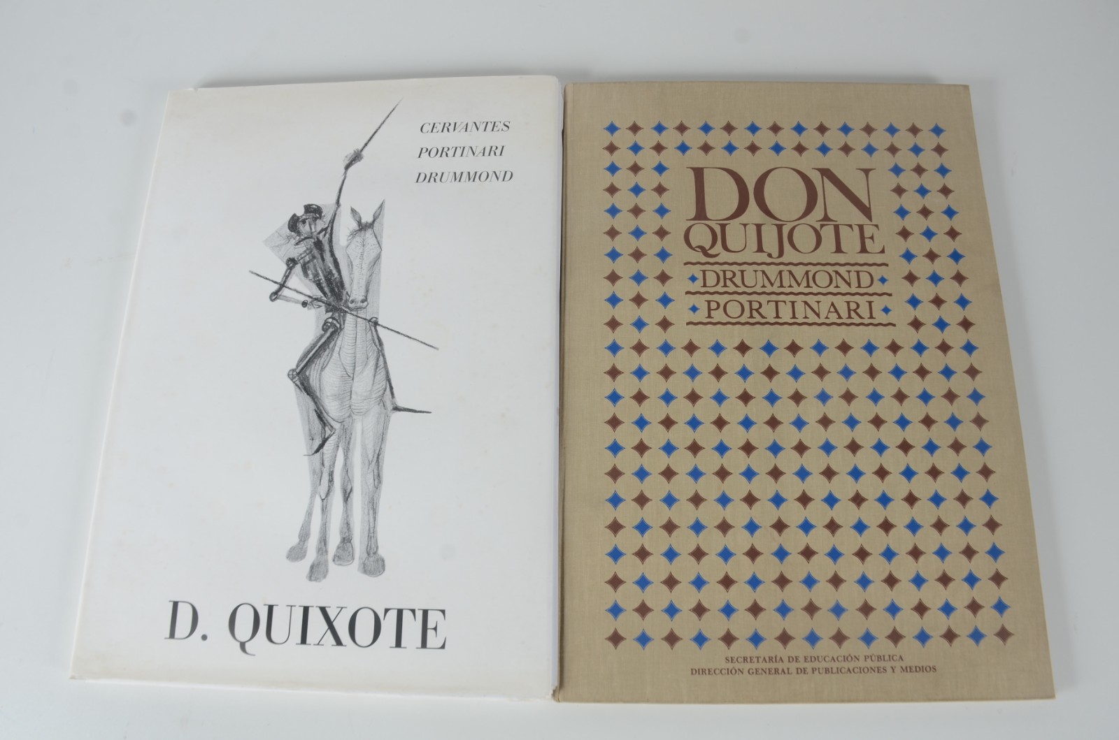 Dois livros sobre "Dom Quixote, Drumond e Portinari", sendo um em... - foto 1 de 8