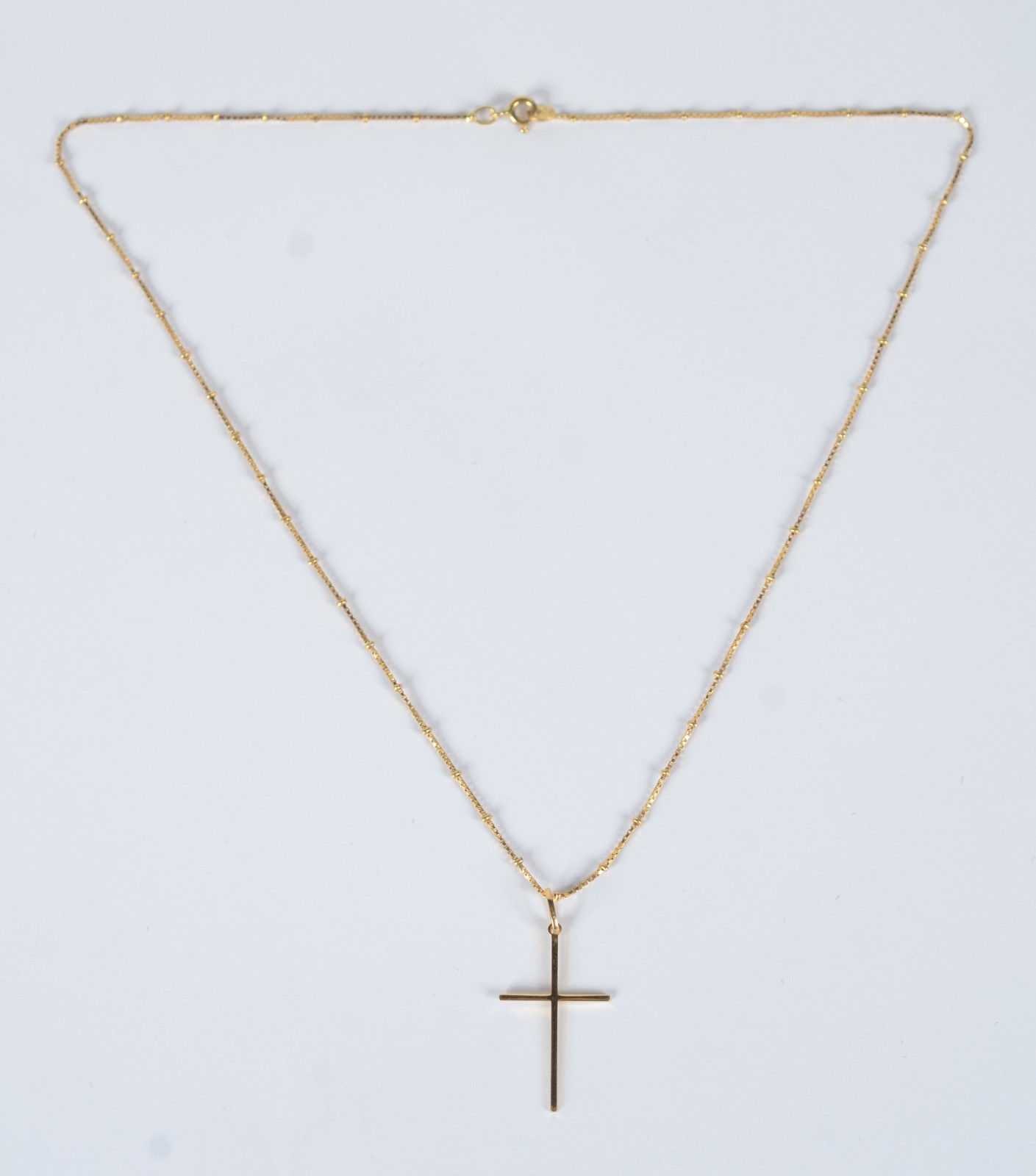 Colar de ouro 18 k., contraste 750 com bolinhas e crucifixo. (Por... - foto 3 de 7