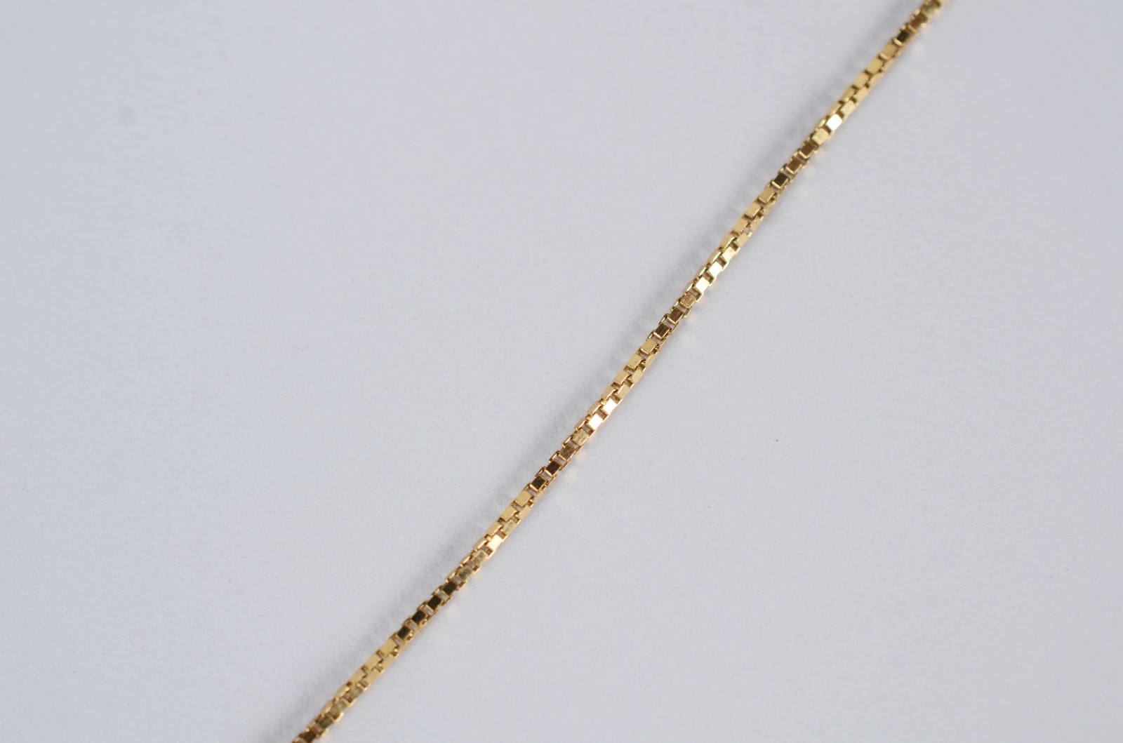 Tornozeleira de ouro 18 k., contraste 750 com pendente. (Por motivos... - foto 3 de 8