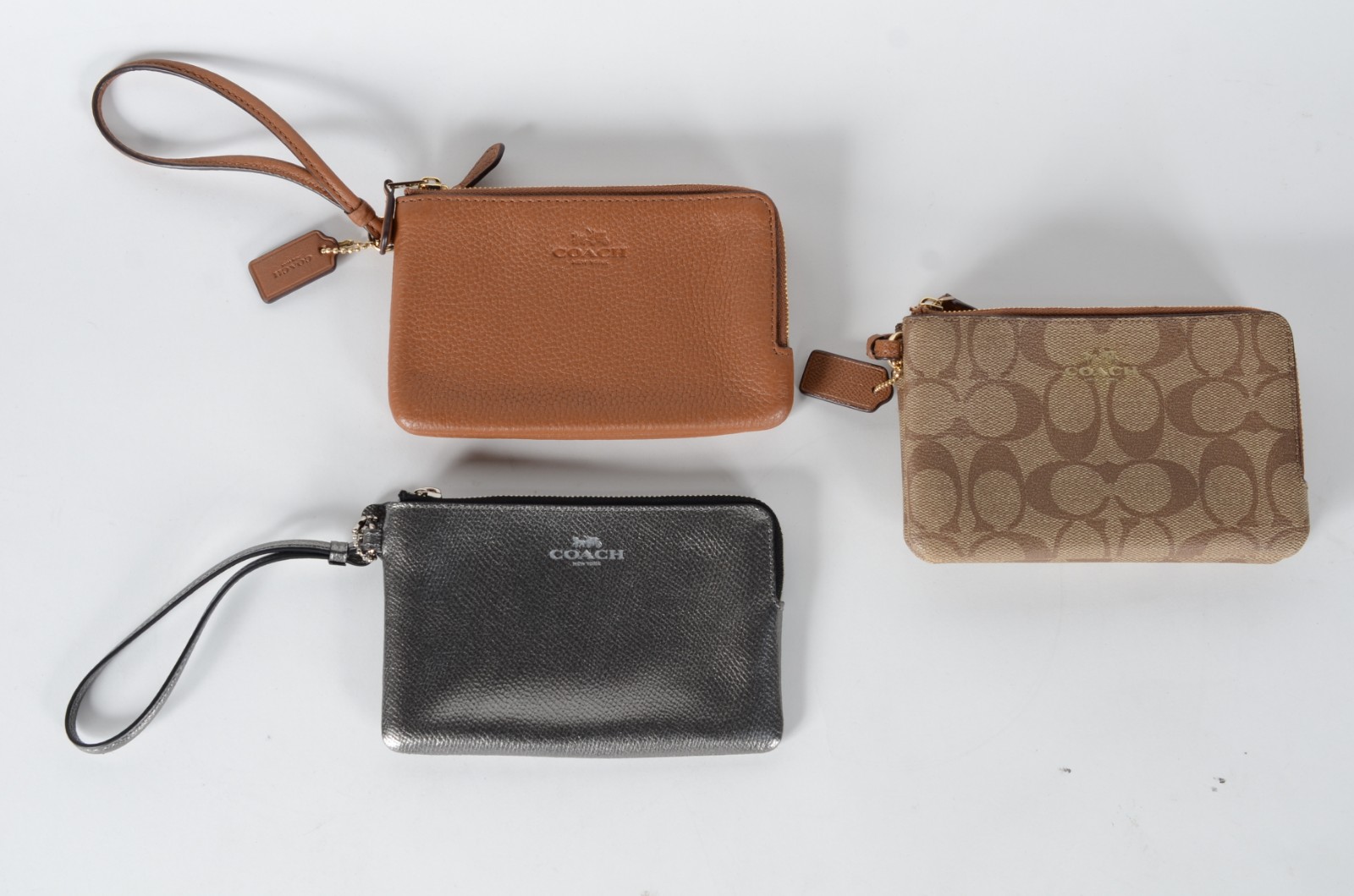 Três bolsas porta níquel, marca COACH. - foto 1 de 11