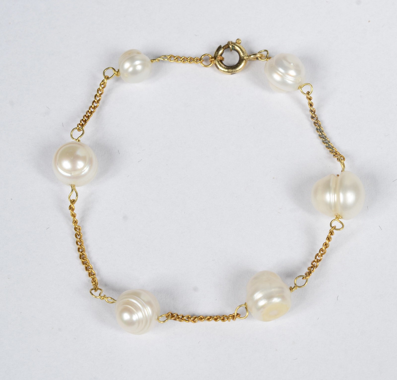 Pulseira de ouro 18 k. com 6 pérolas brancas intercaladas de... - foto 1 de 5