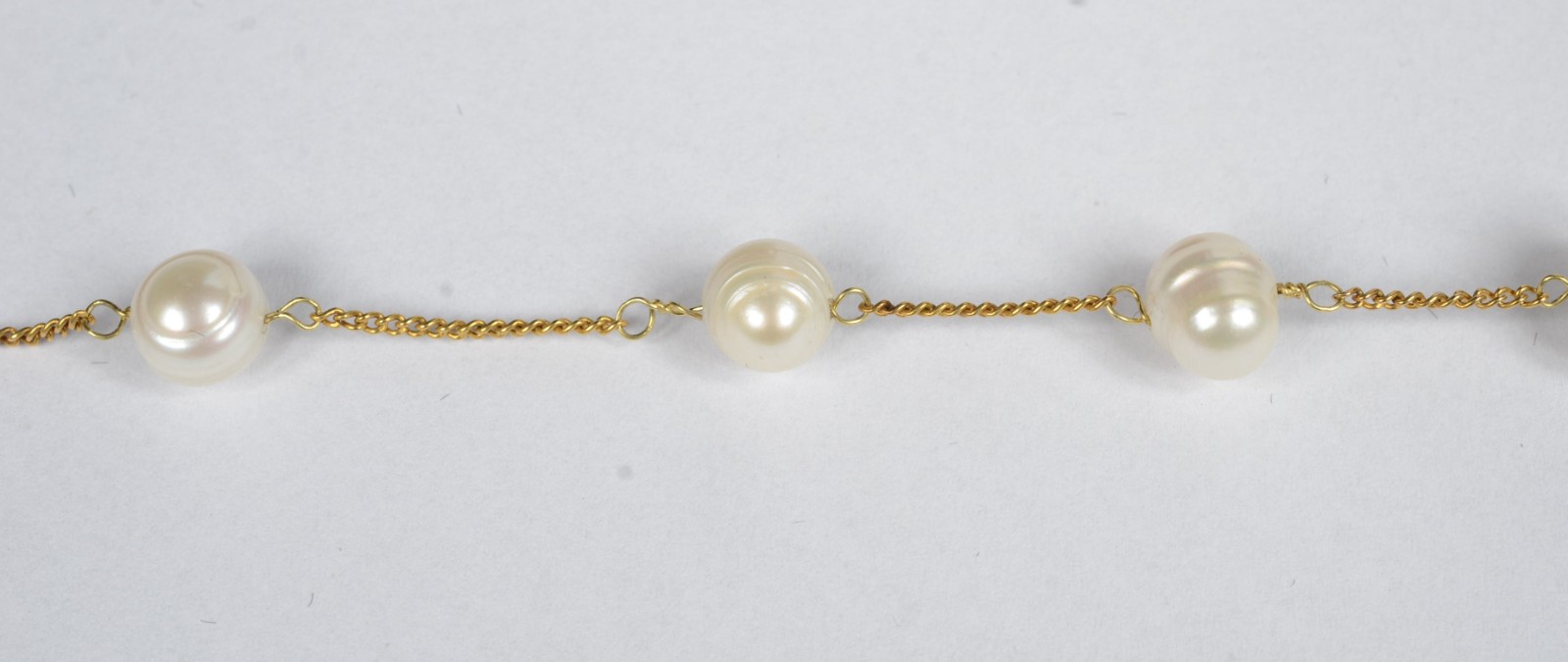 Pulseira de ouro 18 k. com 6 pérolas brancas intercaladas de... - foto 3 de 5