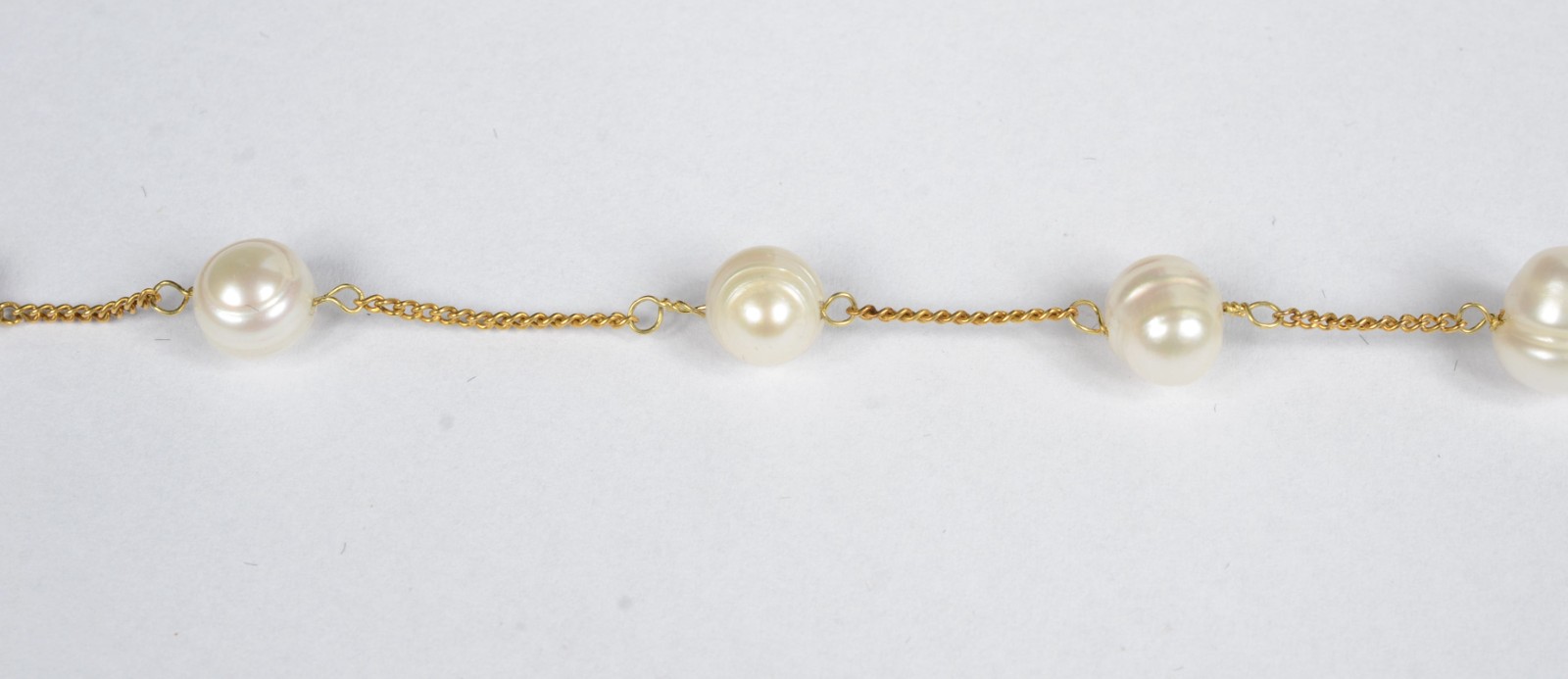Pulseira de ouro 18 k. com 6 pérolas brancas intercaladas de... - foto 4 de 5