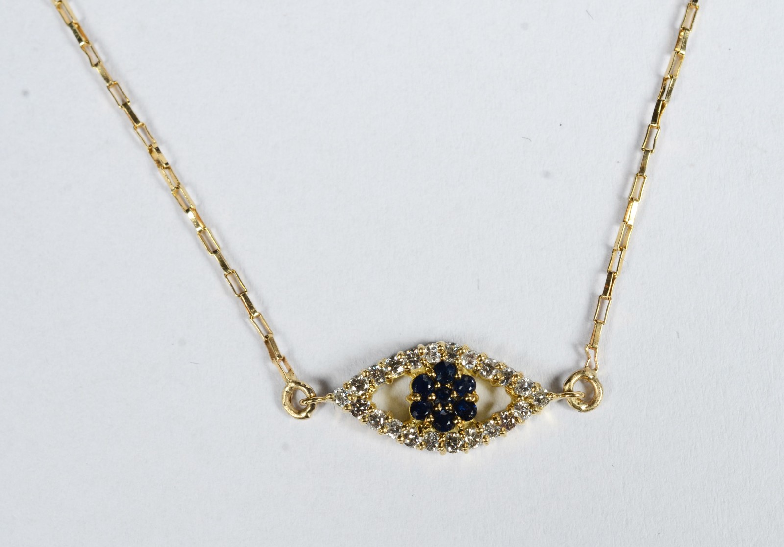 Colar de ouro 18 k., contraste 750 feitio, pendente com safiras e... - foto 1 de 7