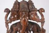Estatueta de madeira oriental entalhada represe... - Estatueta de madeira oriental entalhada representando Ganesha.