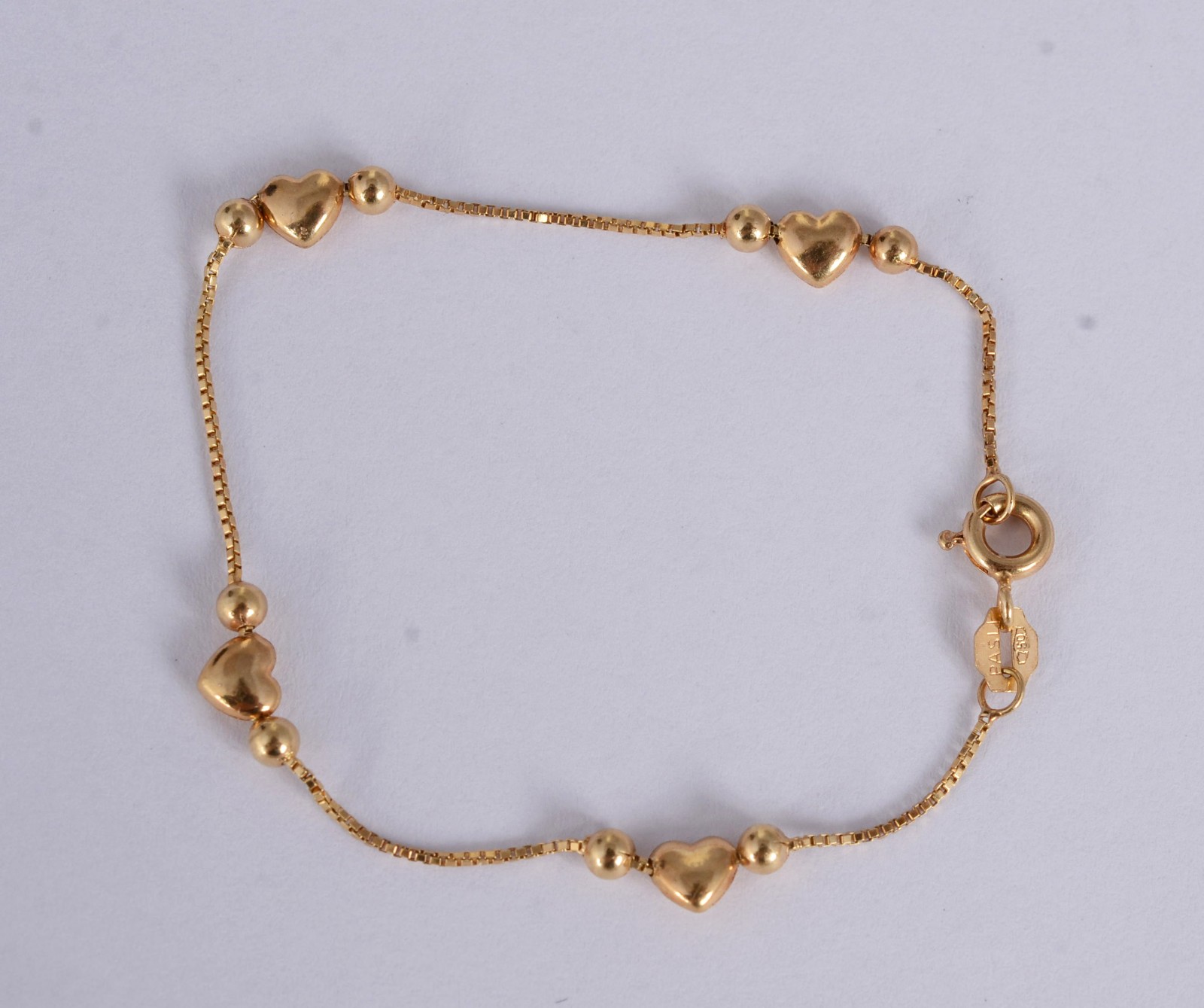 Pulseira infantil de ouro 18 k., de bolinhas e coração. (Por motivos... - foto 1 de 5