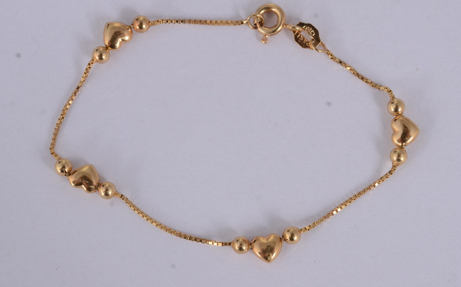 Pulseira infantil de ouro 18 k., de bolinhas e coração. (Por motivos... - foto 2 de 5