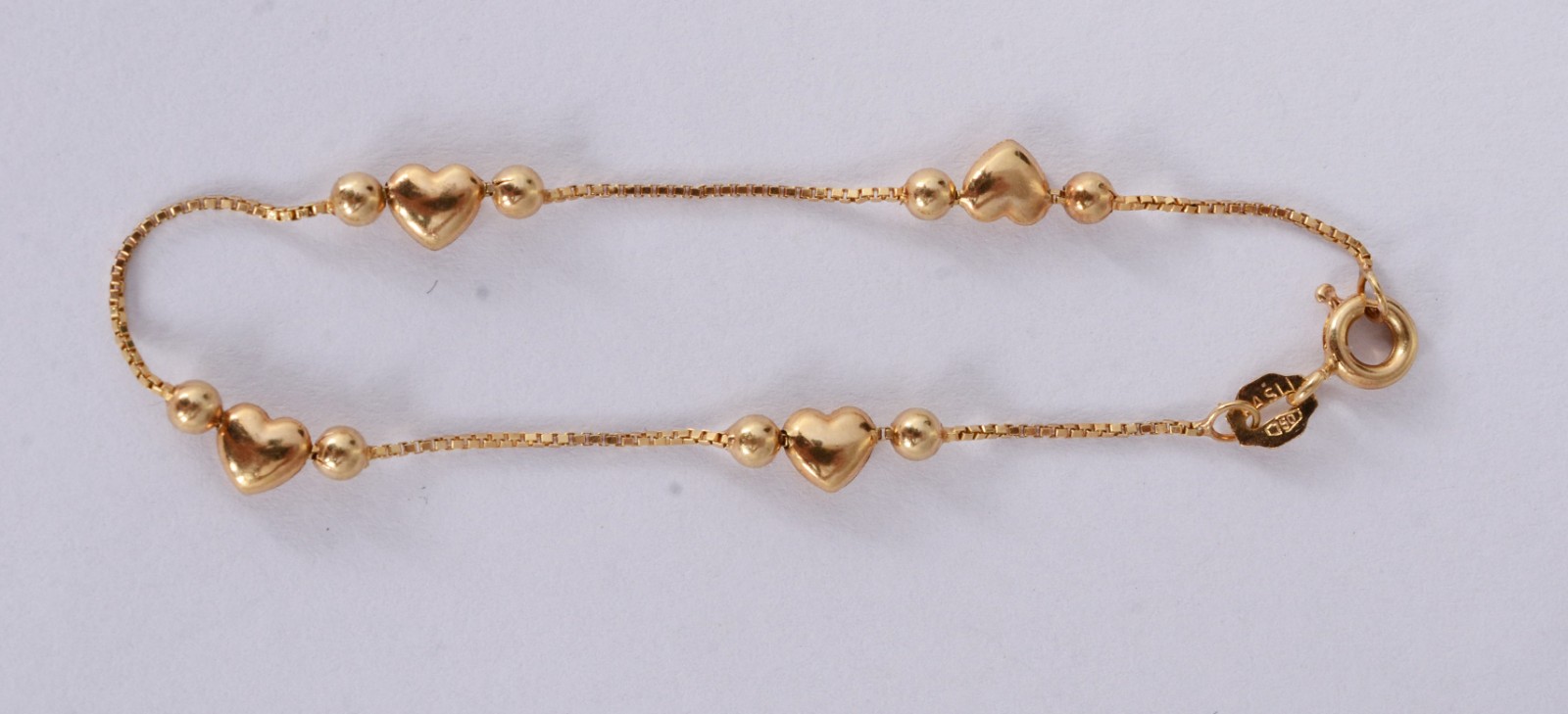 Pulseira infantil de ouro 18 k., de bolinhas e coração. (Por motivos... - foto 4 de 5