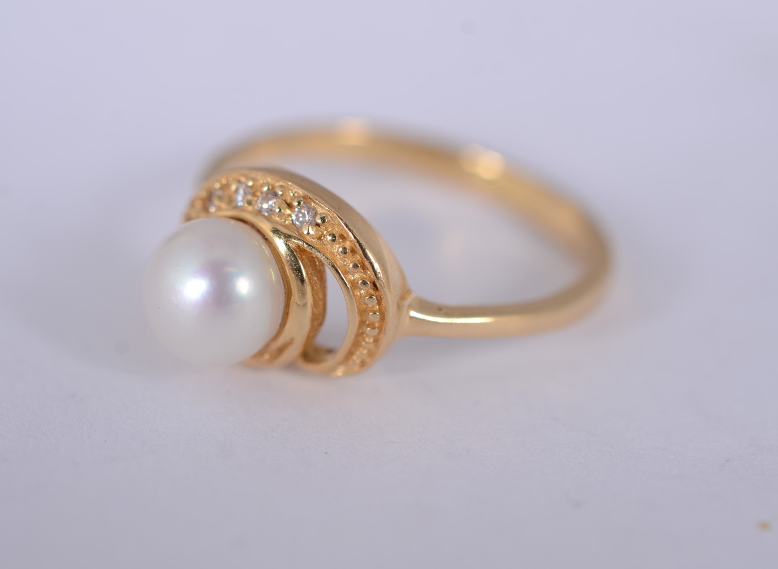 Anel de ouro amarelo 18 k., contraste 750mls com mini brilhantes e... - foto 1 de 7