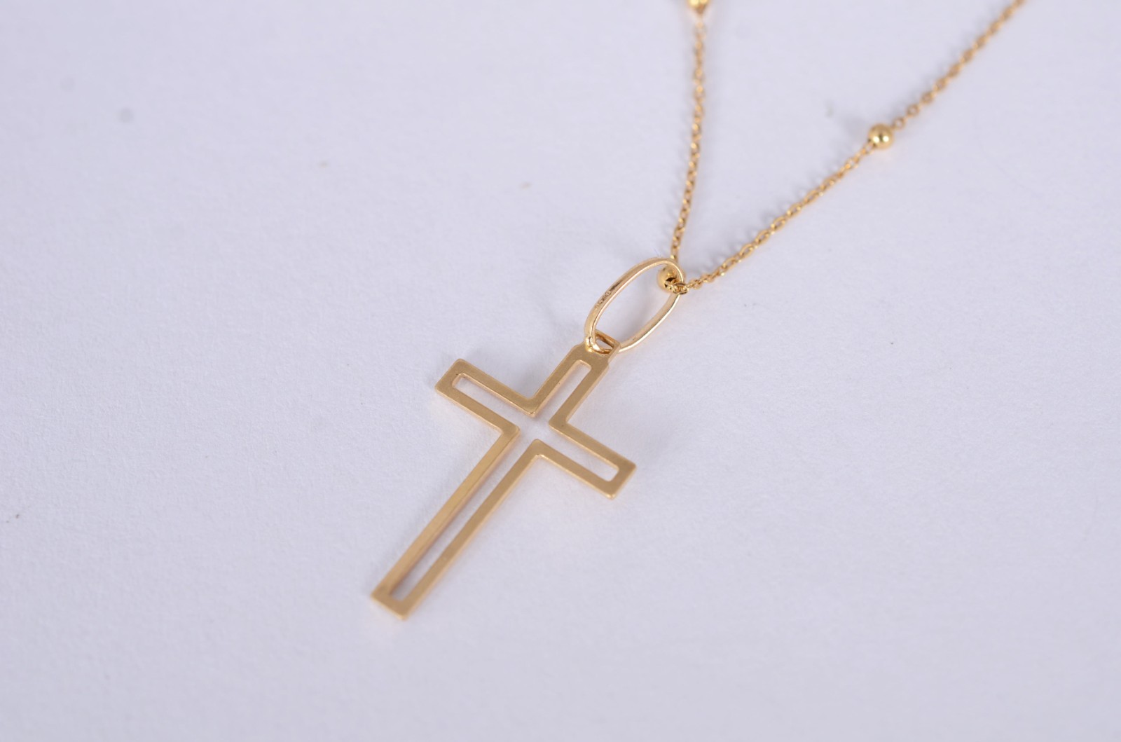 Colar de ouro amarelo 18k., contraste 750mls de bolinhas e crucifixo... - foto 1 de 5