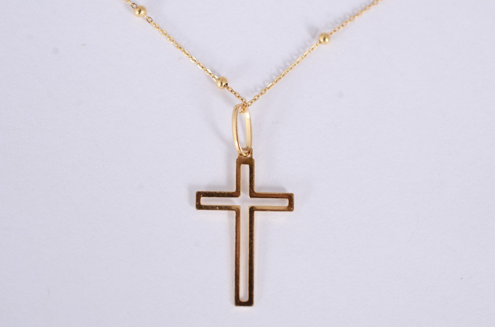 Colar de ouro amarelo 18k., contraste 750mls de bolinhas e crucifixo... - foto 2 de 5
