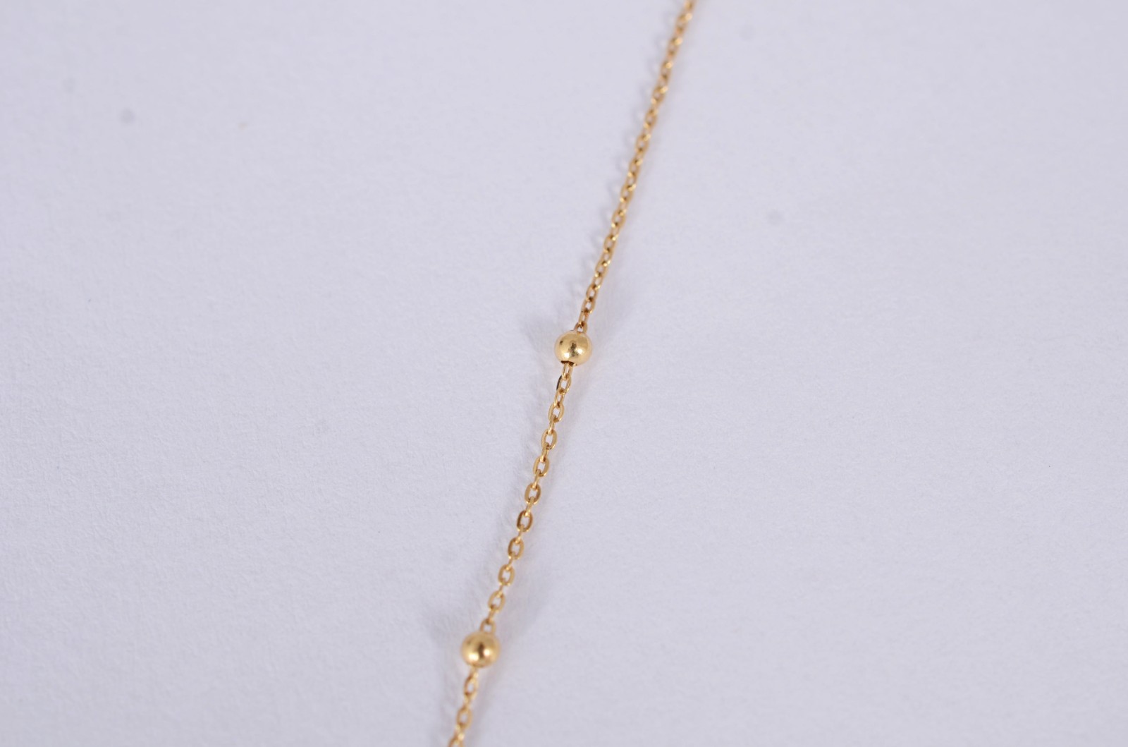 Colar de ouro amarelo 18k., contraste 750mls de bolinhas e crucifixo... - foto 4 de 5