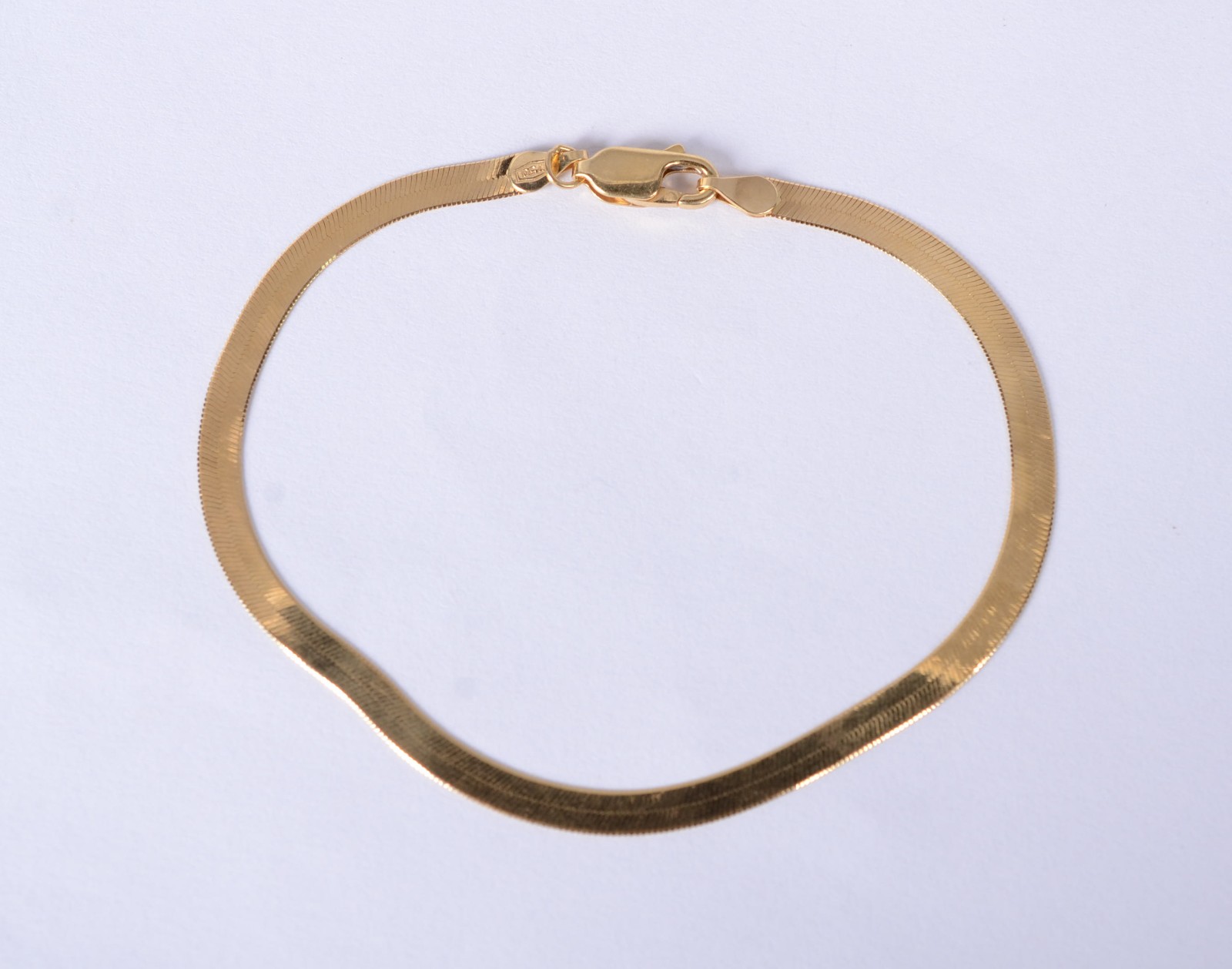 Pulseira de ouro 18 k., contraste 750 mls, feitio lâmina. (Por... - foto 1 de 4