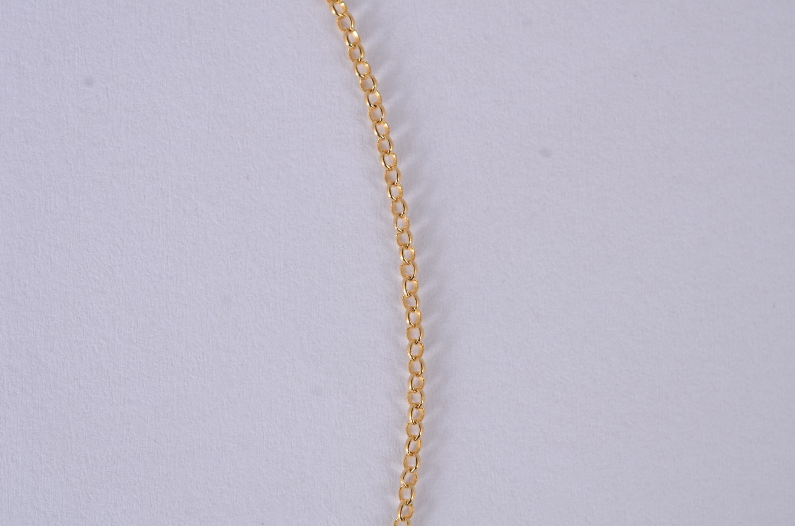 Tornozeleira de ouro 18 k., contraste 750 com élinhos e paca com... - foto 4 de 5