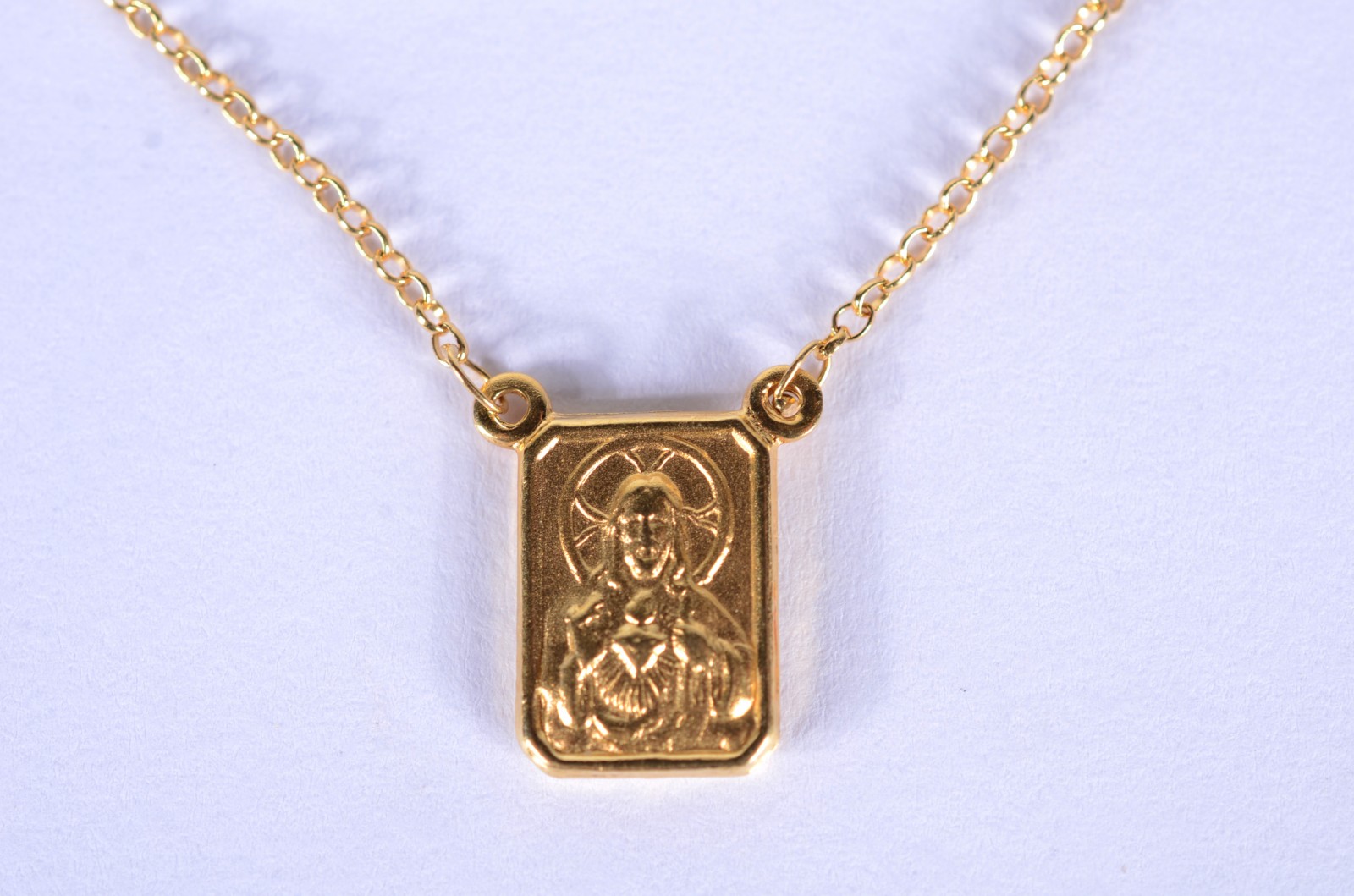 Cordão com pendente com Coração de Jesus de ouro 18 k. (Por motivos... - foto 1 de 8