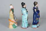 Três esculturas de porcelana policromada repres... - Três esculturas de porcelana policromada representando figuras típicas.