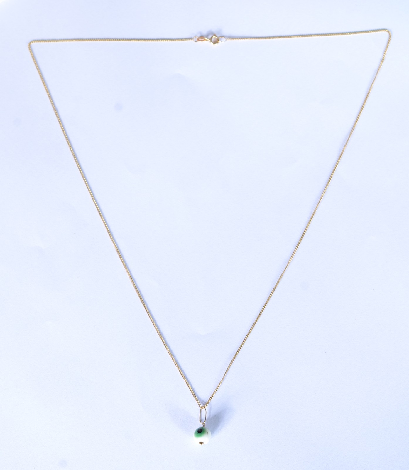 Colar de ouro 18 k., contraste 750 mls com pendente "olho mágico"... - foto 2 de 4