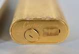 Dois isqueiros, sendo: Cartier em Plaque D'or e... - Dois isqueiros, sendo: Cartier em Plaque D'or e Dupont.