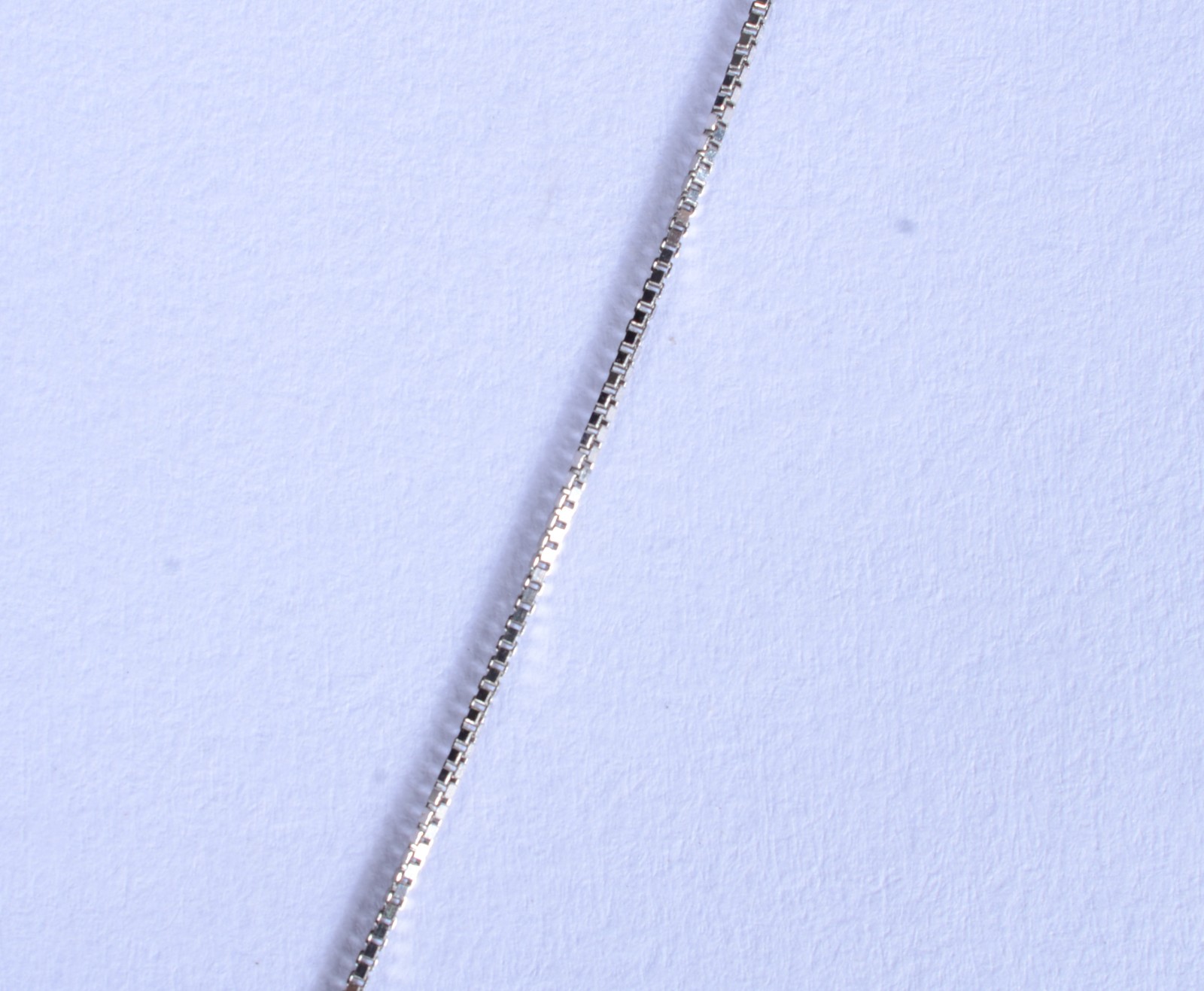 Colar de ouro branco com crucifixo de ouro 18 k. cravejado com... - foto 5 de 8