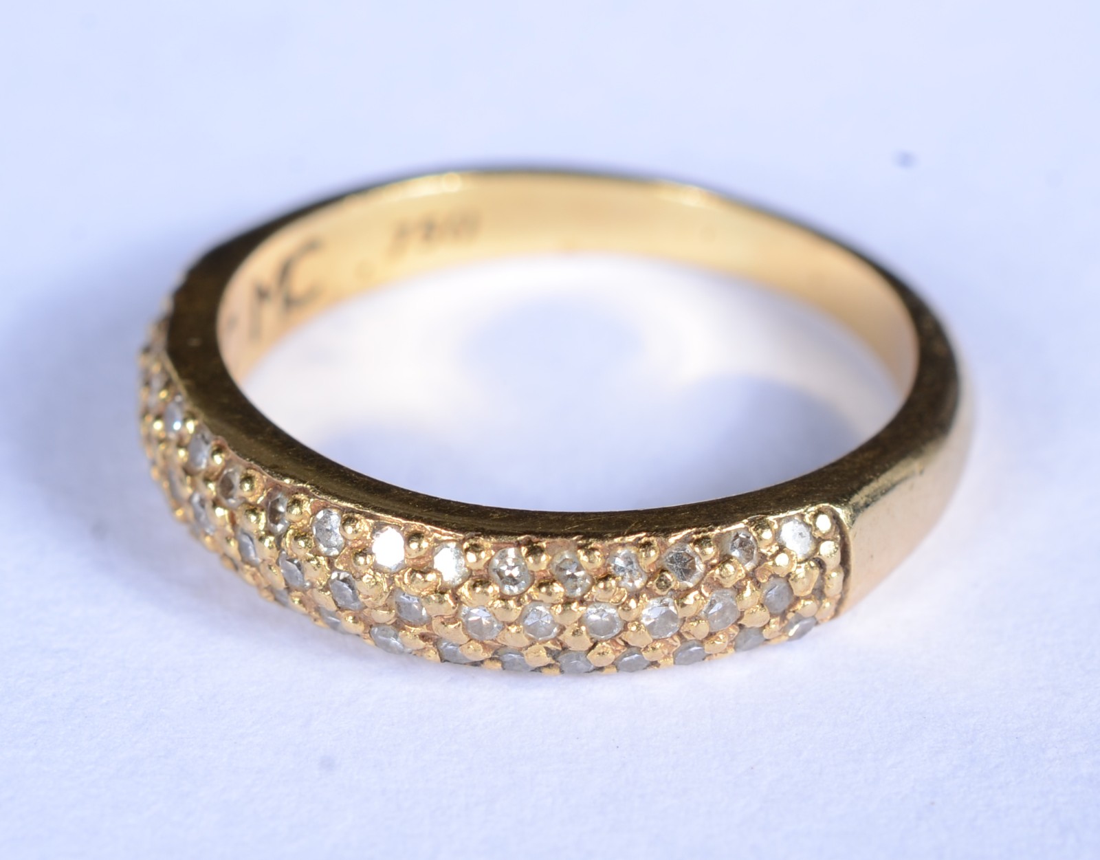 Anel de ouro 18 k., contraste 750 cravejado com brilhantes, aro 12... - foto 1 de 8
