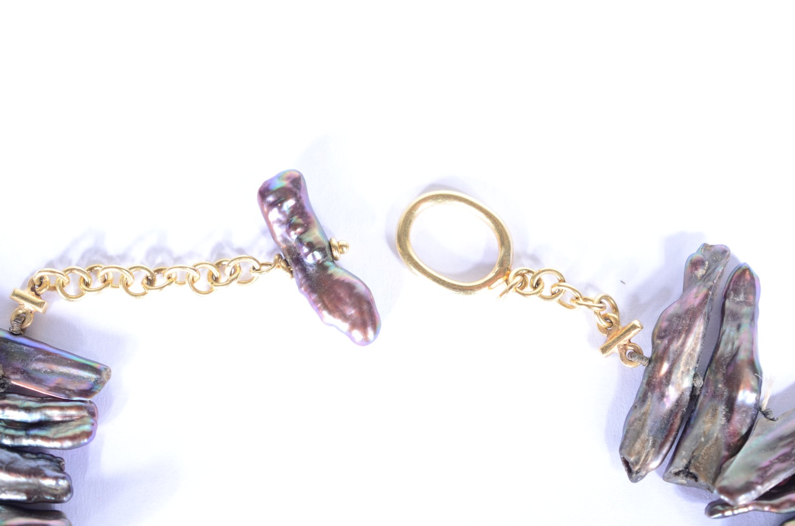 Conjunto de colar e par de brincos de perolas negras e ouro 18 k. - foto 4 de 7