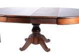 Mesa de jantar de madeira nobre, tampo redondo ... - Mesa de jantar de madeira nobre, tampo redondo com duas tábulas extensoras (40 cm x 120 cm), base em coluna central torneada terminando em quatr...