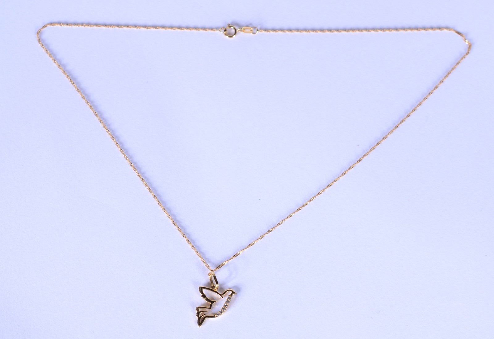 Colar de ouro 18 k., contraste 750 com pendente na forma de pomba da... - foto 2 de 6