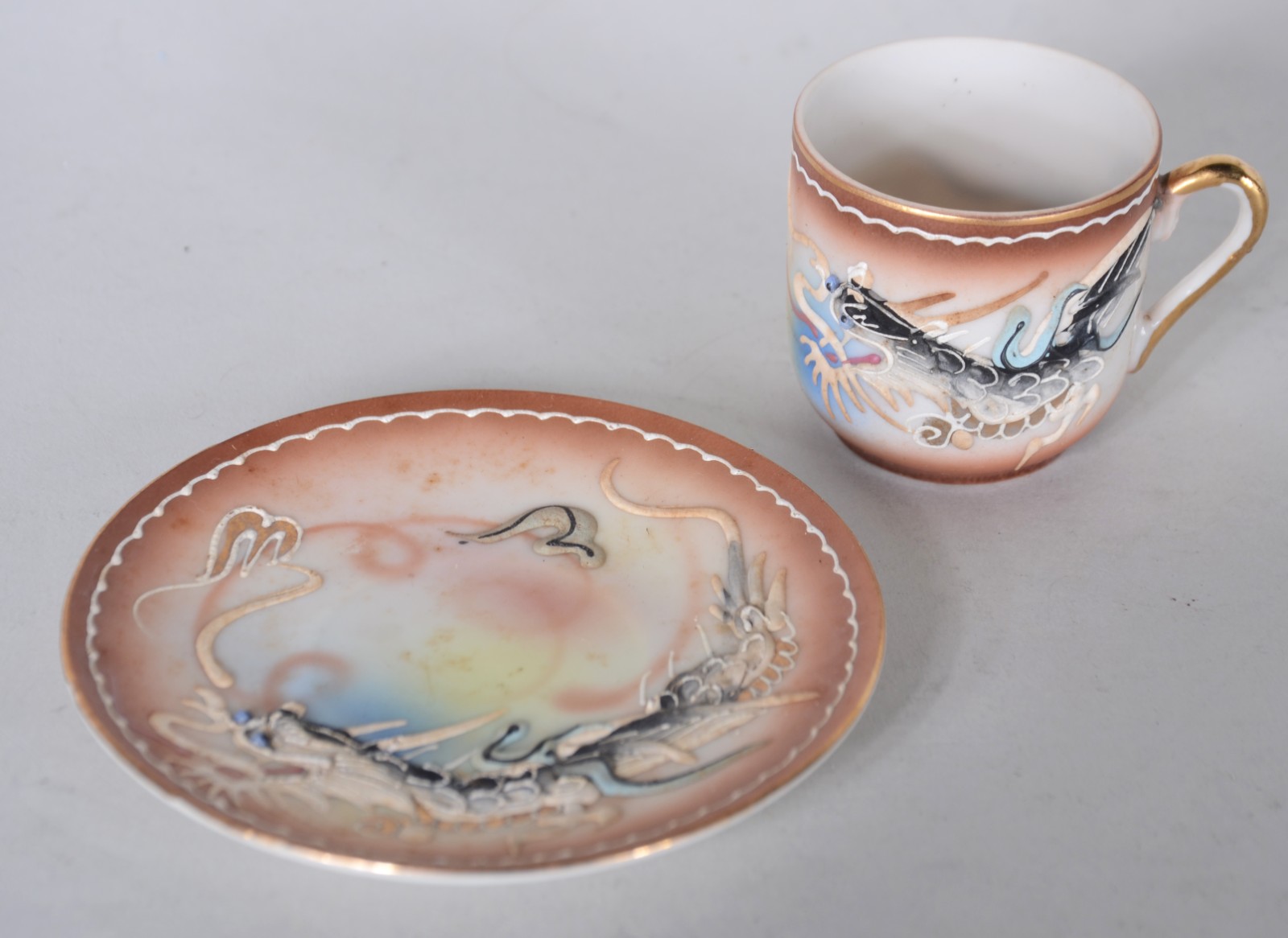 Parte de serviço de porcelana oriental, sendo: 6 xícaras de café e 4... - foto 3 de 8